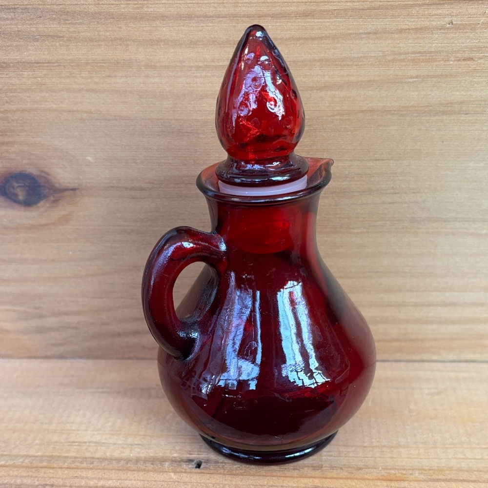 Vintage Avon ruby red cruet bottle with strawberry stopper